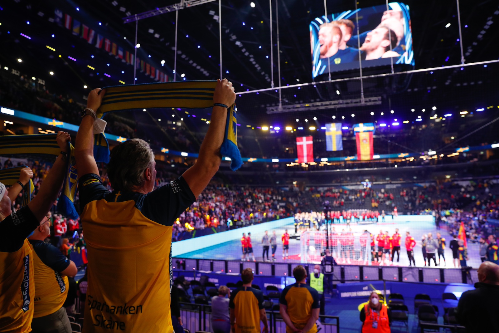 Fans cheering at arena